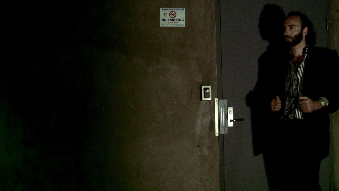 Empire Eyes standing by a doorway